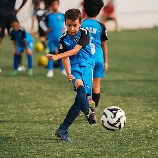 Young Football Players in Action at Academy