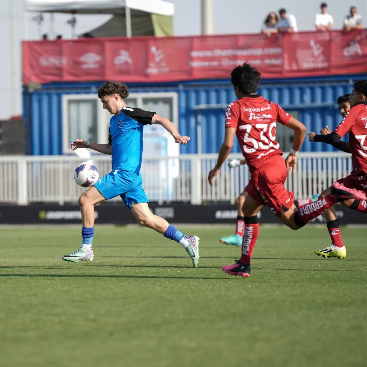 A group of men playing soccer on a field | Mina Cup 2024.