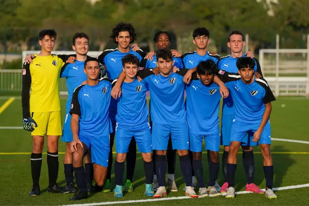 Young Men in Blue Uniforms | Football Training in Dubai