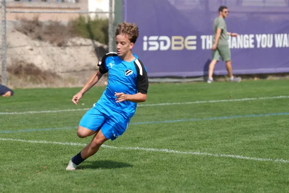 Young Man Chasing Soccer Ball | Football Training for Beginners Near Me