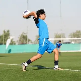 Young Man Preparing to Throw Ball | Register for the Full Season