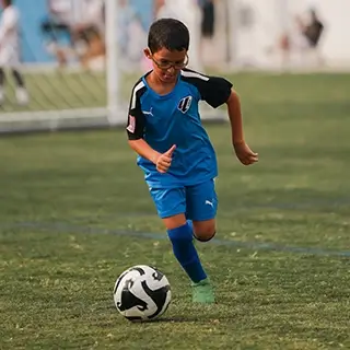 Boy in Action at Children's Football Academy