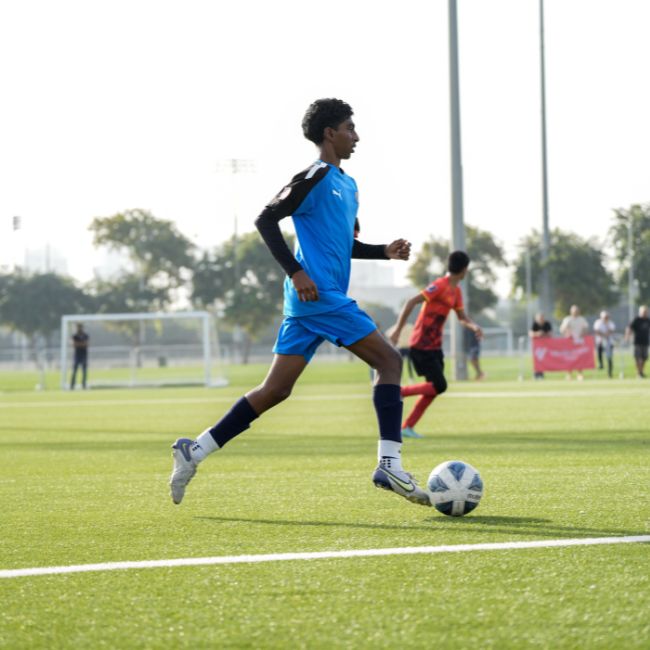 A boy training football at LaLiga Academy Dubai in DUbai Sports City