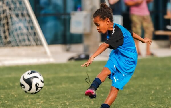 A girl playing a football game at LaLiga Academy Dubai