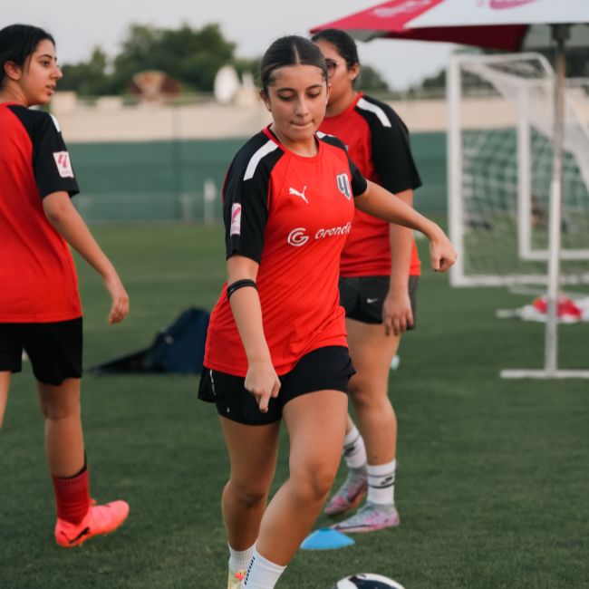 A young girl at LaLiga Academy Dubai practising football at LaLiga Academy in Dubai Sports City