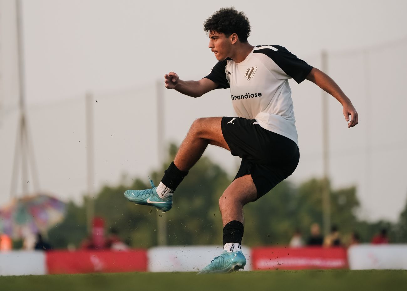 A young boy who plays for LaLiga Academy Dubai during a match in the DOFA League in Dubai Sports City