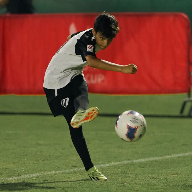 A young boy who plays for LaLiga Academy Dubai during a match in the MINA Cup in Dubai Sports City