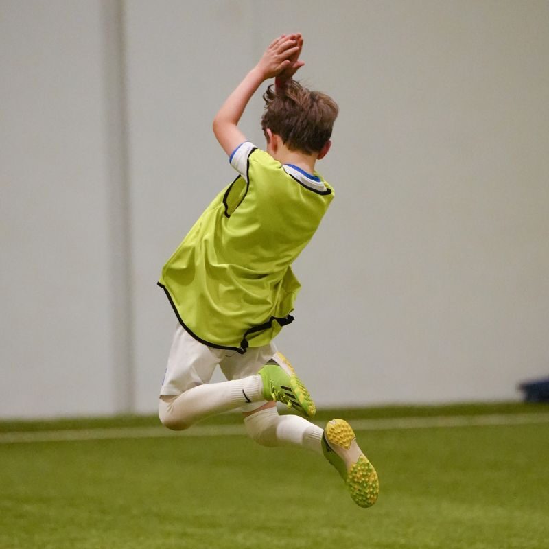 A young boy imitating Ronaldo's celebration at LaLiga Academy Dubai