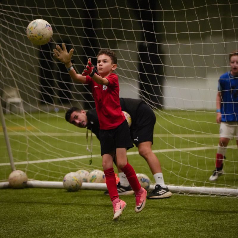 A young goalkeeper at a football camp in LaLiga Academy Dubai in Dubai Sports City