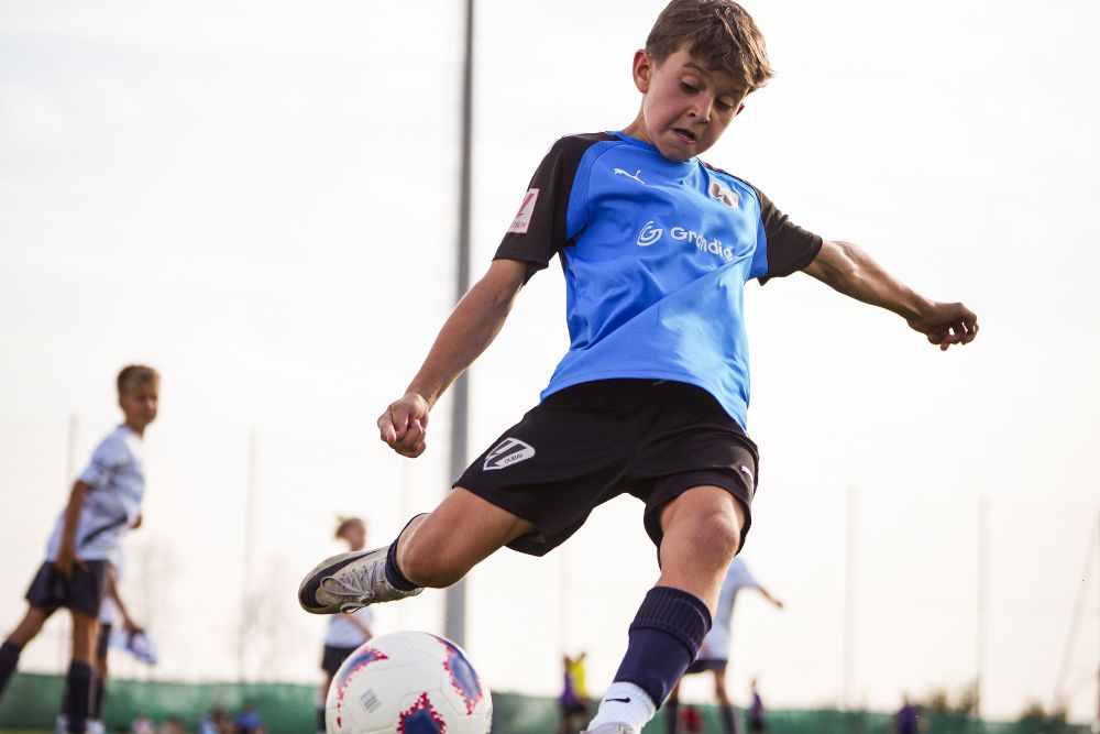 A boy at a high performance football training program near dubai sports city at laliga academy in dubai