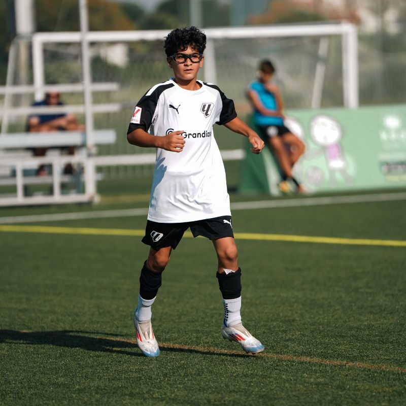 A young boy undergoing advanced football training at La Liga Football Academy in Dubai Sports City