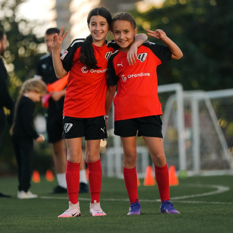 Two young girls at a free trial at la liga academy dubai in dubai sports city