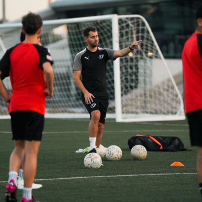 A football coach at a kids football academy in dubai sports city