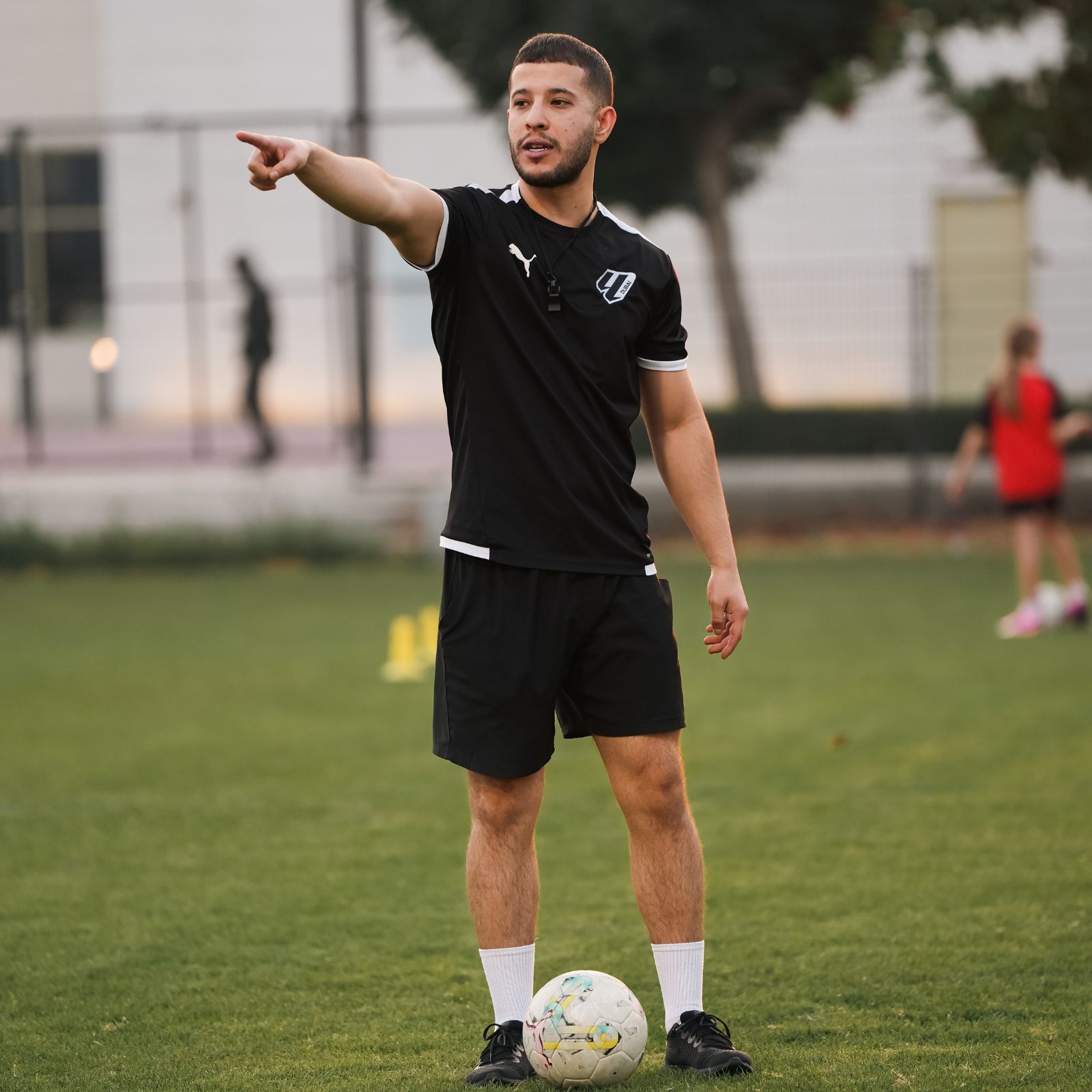 A football coach during Football coaching classes in dubai sports city at LaLiga Academy Dubai